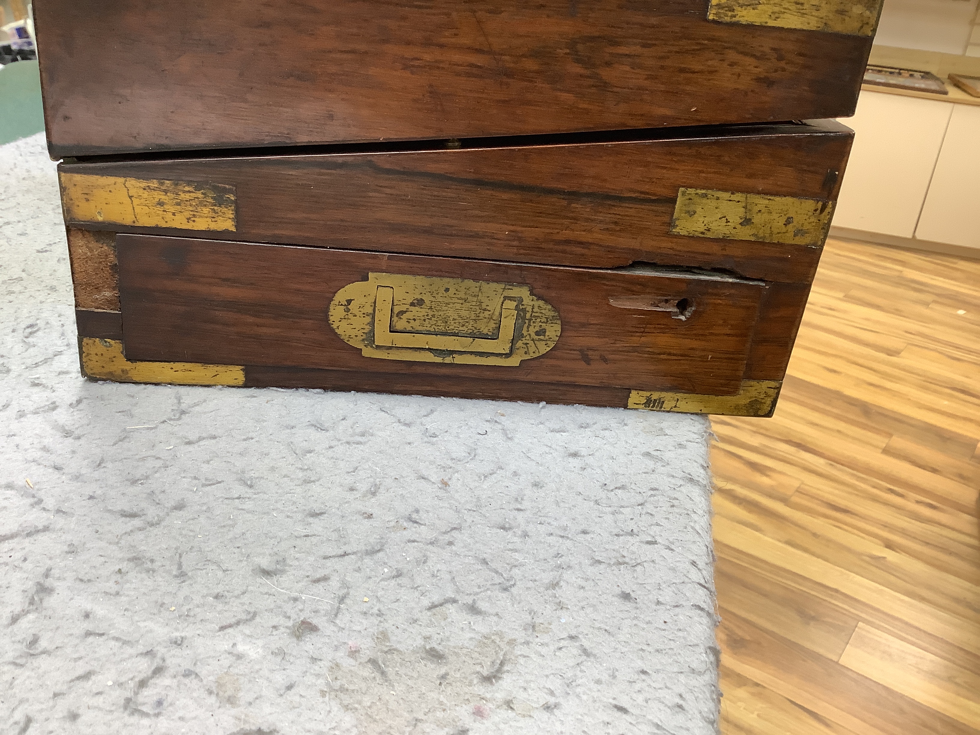 A Victorian rosewood brass bound writing slope, 40cm wide x 15cm high